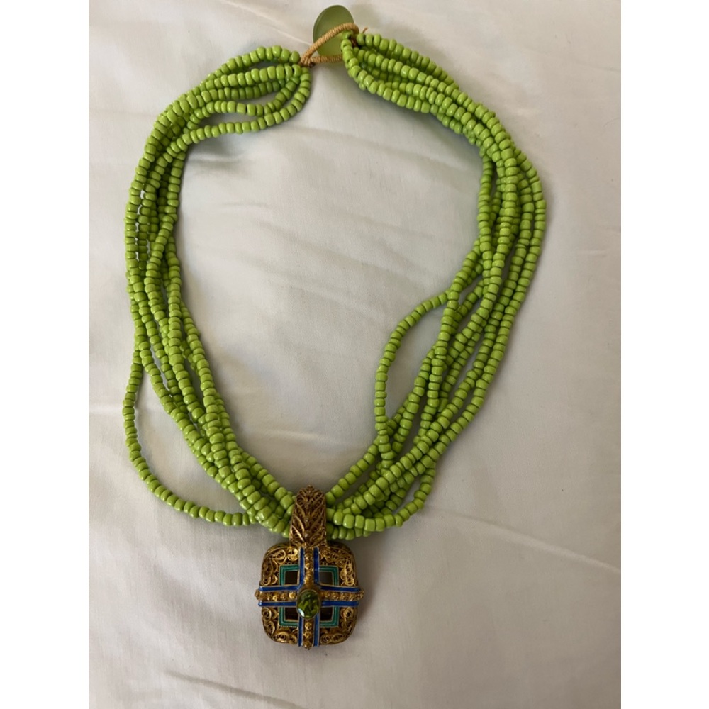 Multi-strand lime-green necklace with medallion